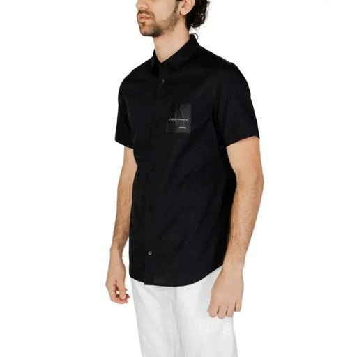 Black short-sleeved button-up shirt with chest pocket by Armani Exchange for men