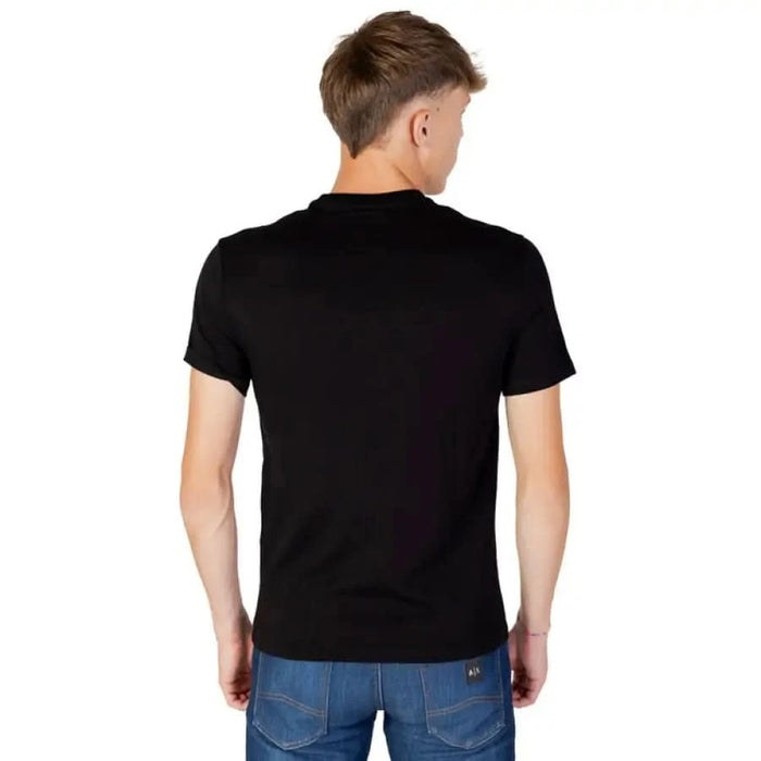 Black short-sleeved t-shirt by Armani Exchange worn by a person, rear view