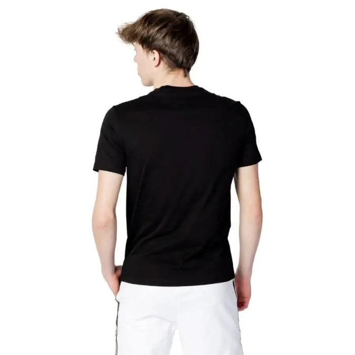 Armani Exchange Men T-Shirt in black, short-sleeved, worn by a person facing backward