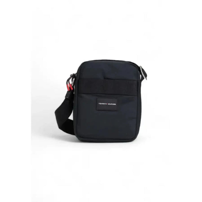 Black shoulder bag with single strap and logo patch by Tommy Hilfiger Men Bag