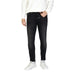 Black skinny jeans by Antony Morato styled with white sneakers and a white sweater