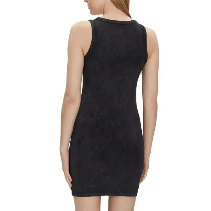 Calvin Klein Jeans Women’s black sleeveless bodycon dress shown from the back