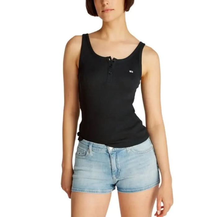 Black sleeveless tank top with button detail and light denim shorts by Tommy Hilfiger