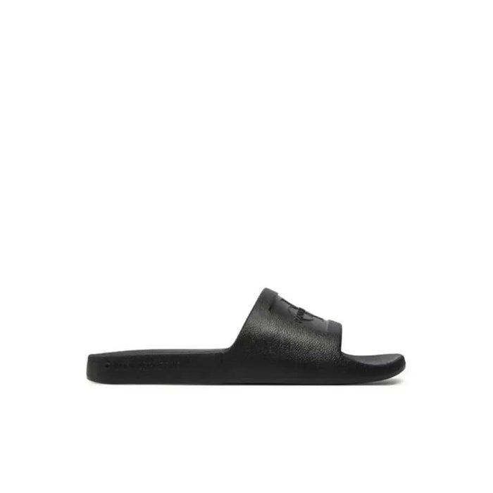 Calvin Klein Jeans Women Slippers: Black slide sandal with textured strap and logo