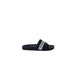 Black slide sandal featuring a white branded strap from Emporio Armani Underwear