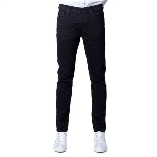 Black slim-fit denim jeans paired with white sneakers from Only & Sons Men Jeans