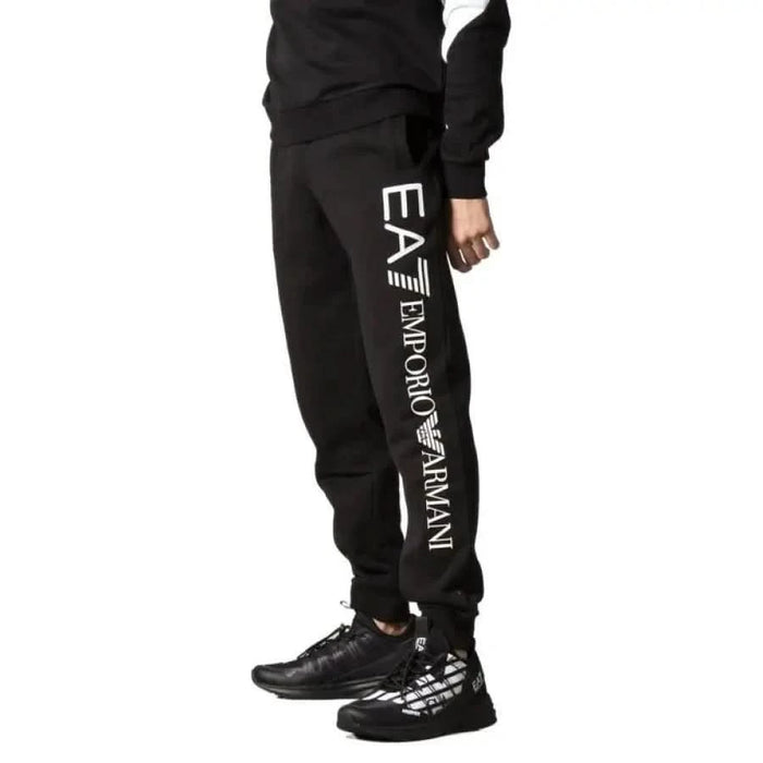 Black EA7 Emporio Armani sweatpants featuring logo print on the leg