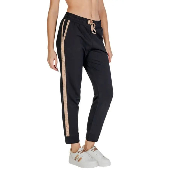 Black sweatpants with gold metallic side stripe and drawstring waist by Alviero Martini