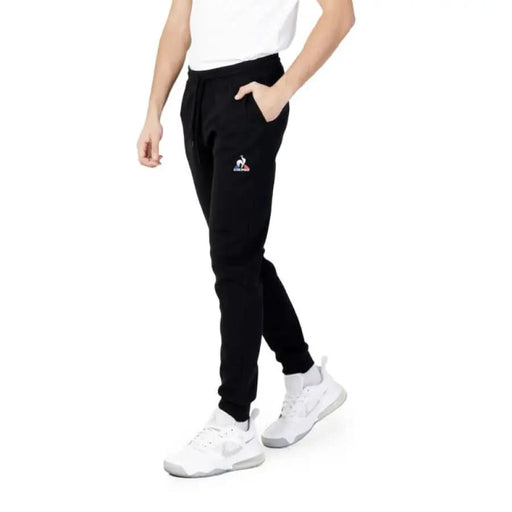 Le Coq Sportif Men Trousers - Black sweatpants with small logo on upper thigh