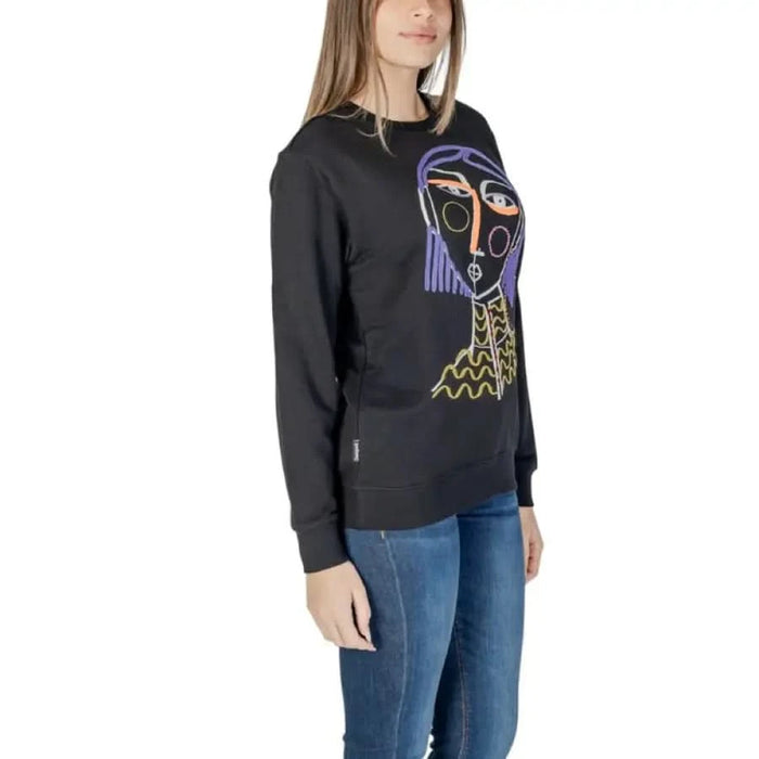 Black sweatshirt with abstract purple and yellow face design by Desigual