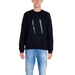 Armani Exchange Men Sweatshirt with ’AX’ logo paired with blue jeans