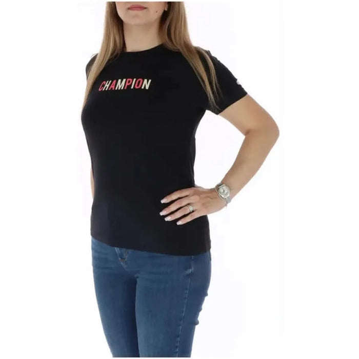 Black Champion Women T-Shirt with colorful ’CHAMPION’ text across the chest