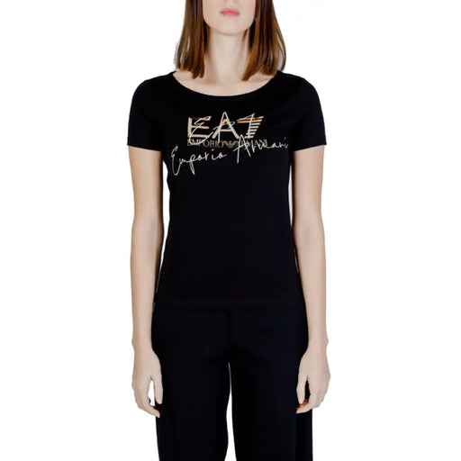 Black EA7 women’s t-shirt featuring a gold logo and text design on the front