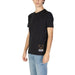 Black Moschino Underwear Men T-Shirt featuring iconic teddy bear logo at hem