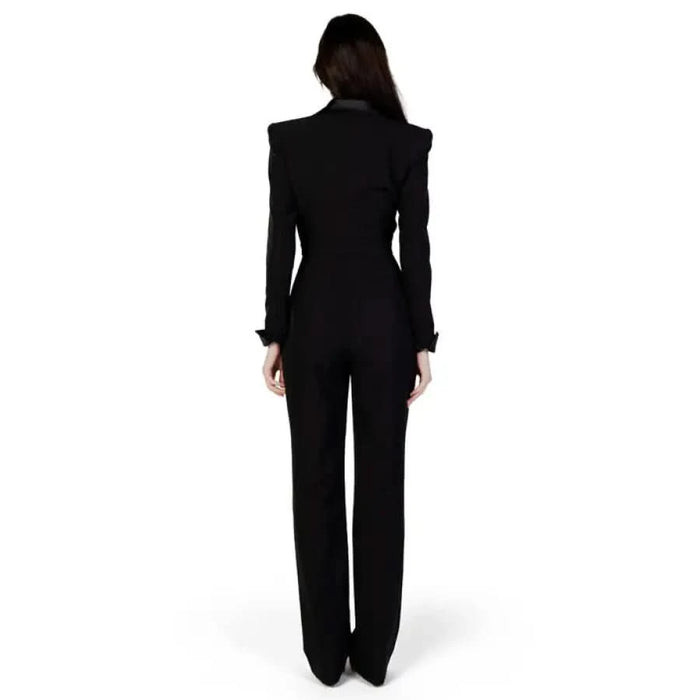 Black tailored jumpsuit by Silence featuring a sophisticated lapel collar design