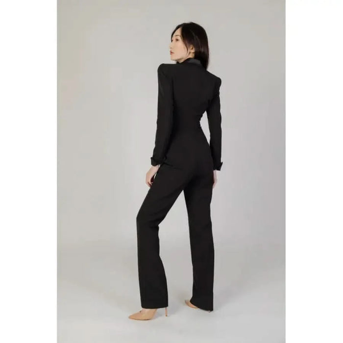 Black tailored jumpsuit featuring a lapel collar from Silence Women