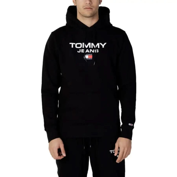 Black Tommy Jeans hoodie with white logo and small flag emblem from Tommy Hilfiger Jeans Men Sweatshirts