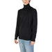 Black Turtleneck Knit Sweater by Gas paired with light blue jeans for a stylish look