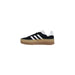 Black and white Adidas Women’s Black Suede Sneakers displayed on a neutral background