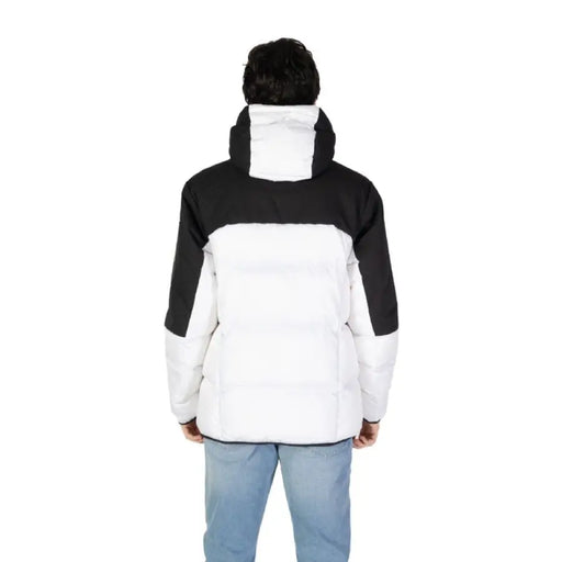 Black and white color-blocked winter puffer jacket displayed from the back