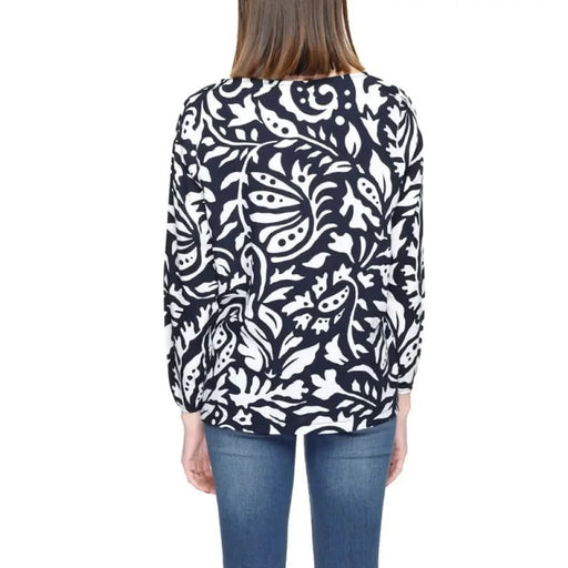 Black and white floral print long-sleeved top paired with blue jeans from Street One