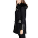 Black winter coat with fur-trimmed collar and leather accents by Morgan De Toi