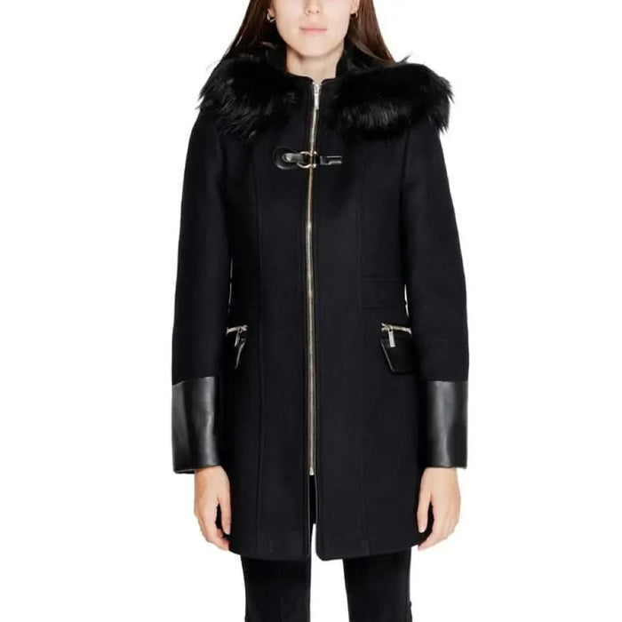 Black wool coat with faux fur collar and leather trim by Morgan De Toi