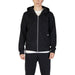 Black zip-up hooded sweatshirt paired with a white undershirt from Underclub