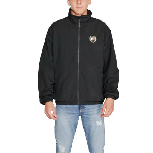 Black zip-up Tommy Hilfiger Men Jacket featuring a small circular logo on the chest