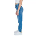 Calvin Klein blue denim jeans with white sneakers and a cropped white top for women