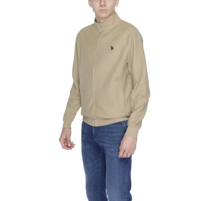 Boy in U.S. Polo Assn. beige jacket and jeans embodying urban city fashion