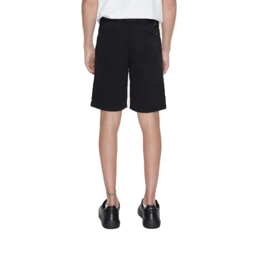 Boy in Boss Men Shorts showcasing urban city style fashion