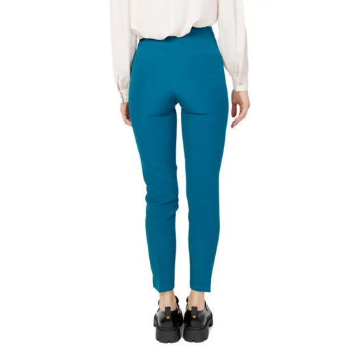 Bright blue skinny pants worn by a person, featured in Hanny Deep Women Trousers