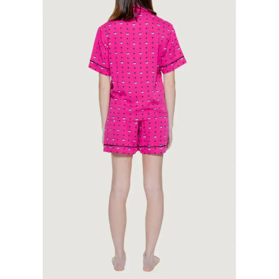 Bright pink pajama set with short sleeves and shorts featuring a small repeating pattern