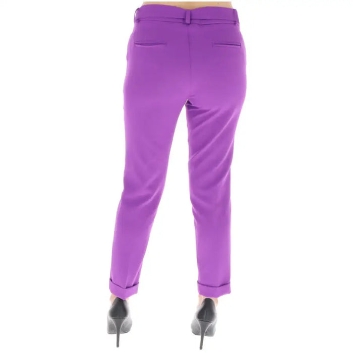 Bright purple tailored trousers with cuffed hems and belt loops from Sol Wears Women