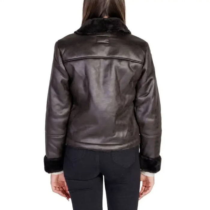 Brown leather jacket with black fur trim from the back by Jacqueline De Yong