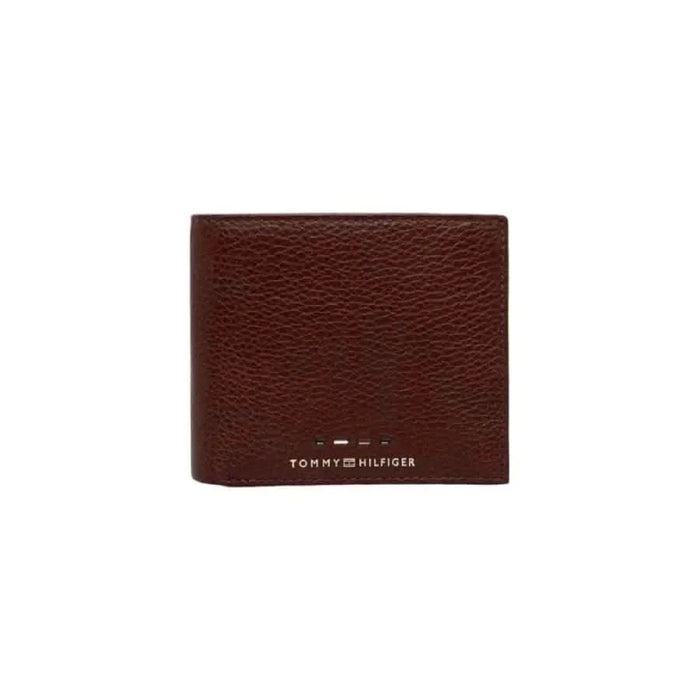 Brown leather Tommy Hilfiger wallet featuring brand logo, ideal for men