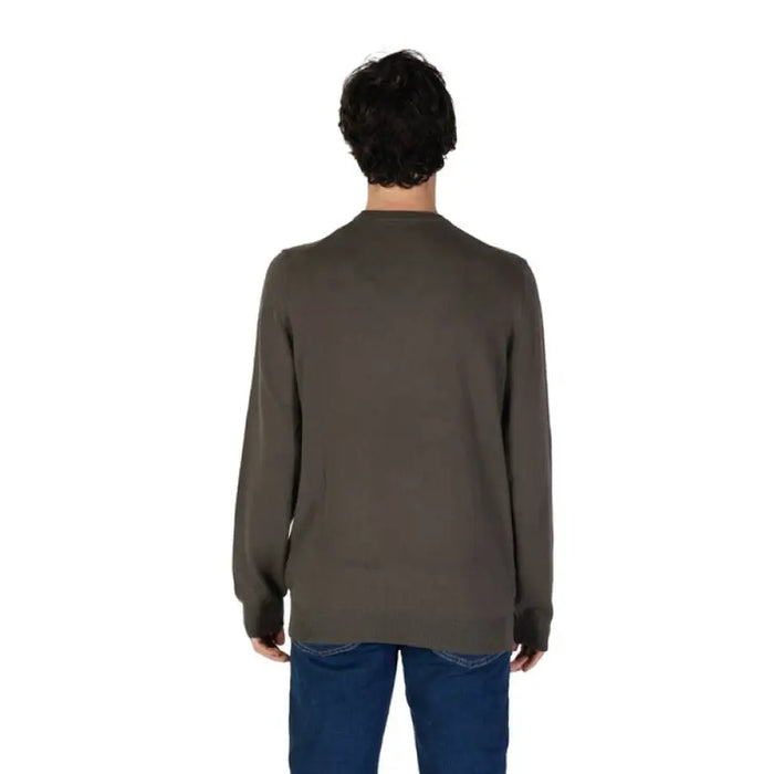 Brown long-sleeved sweater styled with blue jeans from Gas Men’s Knitwear collection