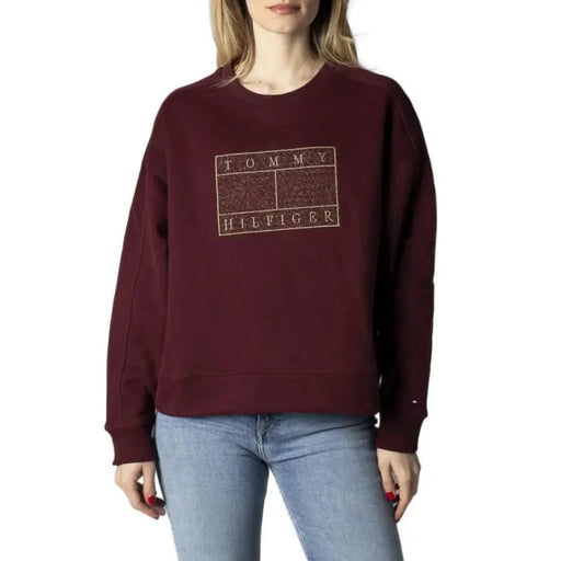 Burgundy Tommy Hilfiger sweatshirt with gold logo graphic, part of Tommy Hilfiger Jeans Women