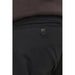 Button on a black fabric pocket of Jack & Jones Men Trousers