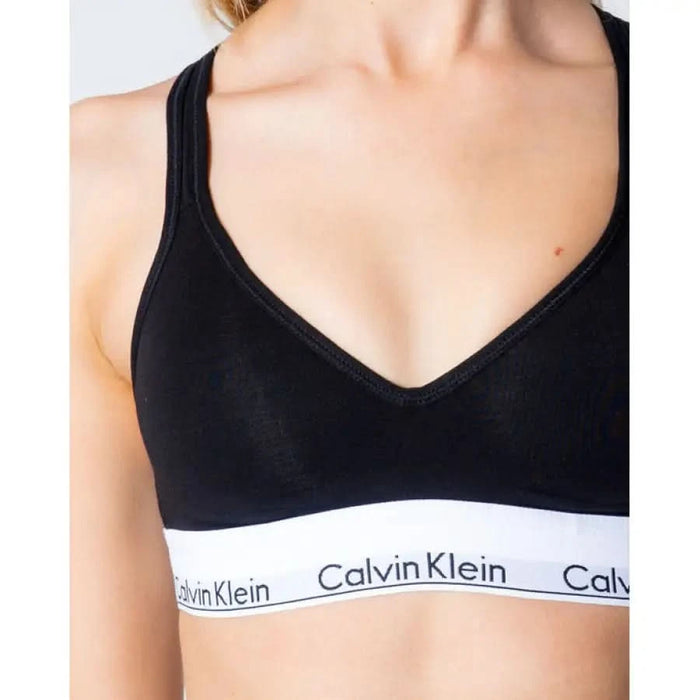 Calvin Klein sports bra with black top and white branded elastic band for women