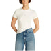 Classic white crew neck t-shirt with blue jeans styled as Tommy Hilfiger women’s outfit