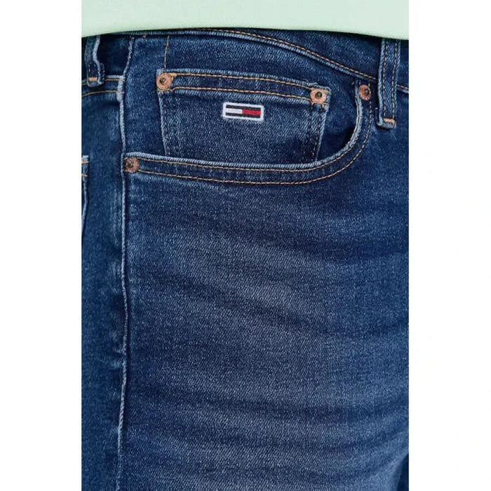 Close-up of blue denim jeans pocket featuring Tommy Hilfiger logo on Tommy Hilfiger Jeans