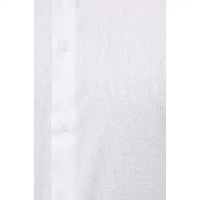 Close-up view of white button-up shirt fabric from Calvin Klein Men Shirt collection