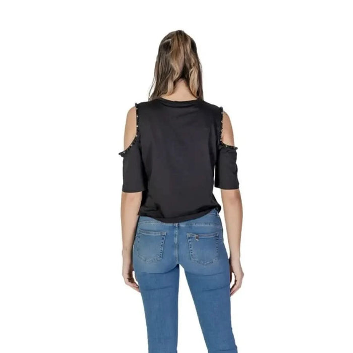 Cold-shoulder black top with distressed edges and blue jeans for Liu Jo women’s fashion