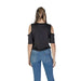 Cold-shoulder black top with distressed edges and blue jeans for Liu Jo women’s fashion