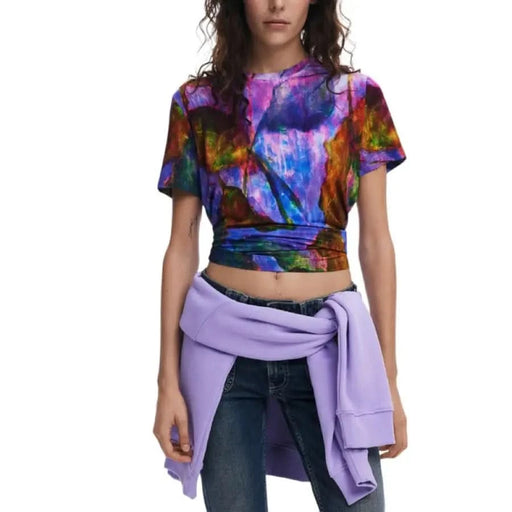 Colorful tie-dye crop top with lilac sweater tied at waist from Desigual Women’s collection