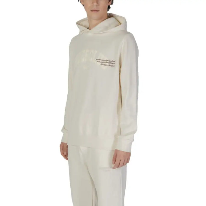 Cream-colored hooded sweatshirt with minimal text, ideal for Fall and Winter