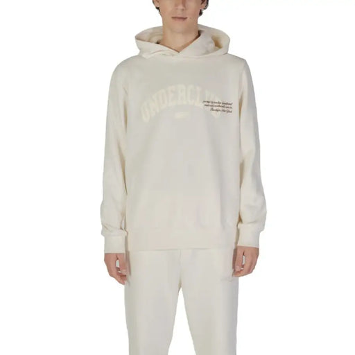 Cream-colored hooded sweatshirt with text detailing from Underclub for fall and winter