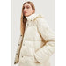 Cream-colored puffer jacket with high collar and button closure by Desigual